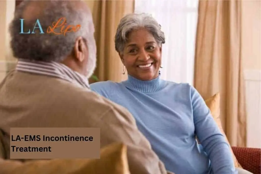 Couple sat smiling at each other - LA-EMS treatment Liphook